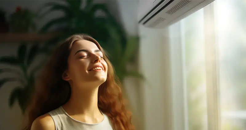 Young woman enjoying the AC