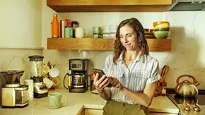 woman-on-phone-in-kitchen