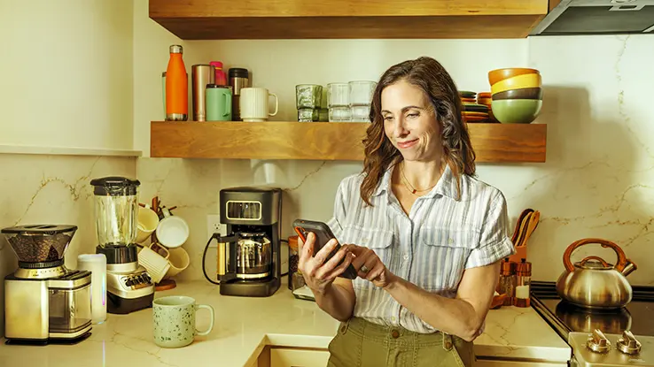 woman-on-phone-in-kitchen
